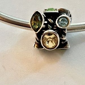 Beautiful Chamilia charm with green blue and yellow stones